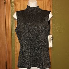 Nwt Peter Nygard Black And Silver Metallic Sleeveless Turtleneck. Size Pm. 15" From Underneath Arm To Waist. In Excellent Condition. Comes From Smoke Free Home. Silver Sleeveless Tank Top For Night Out, Silver Sleeveless Top For Night Out, Elegant Shimmer Sleeveless Top, Elegant Sleeveless Shimmer Top, Silver Fitted Tank Top, Silver Sleeveless Top For Evening, Elegant Silver Sleeveless Tank Top, Elegant Silver Sleeveless Top, White Polka Dot Top