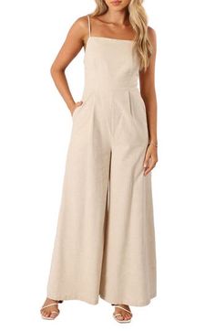 A modern squared neckline tops this sunshine-ready jumpsuit popped with flowy wide legs and made from a lightweight blend of cotton and linen. Hidden side-zip closure Square neck Adjustable straps Side-seam pockets Partially lined 70% cotton, 30% linen Hand wash, dry flat Imported Linen Jumpsuits And Rompers For Summer, Solid Color Linen Jumpsuits And Rompers For Summer, Wide Leg Strapless Jumpsuit For Spring, Wide Leg Strapless Jumpsuit For Day Out, Neutral Casual Jumpsuits And Rompers For Summer, Chic Cotton Strapless Jumpsuit For Spring, Casual Cotton Strapless Jumpsuit For Summer, Chic Strapless Cotton Jumpsuit For Spring, Spring Strapless Wide Leg Jumpsuit