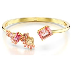 This romantic bangle is inspired by the delicate hues of Japan’s cherry blossom flower. The open-ended design is gold-tone plated and features a diverse mix of fancy cut crystals and Swarovski Zirconia in vibrant shades of pink and champagne. Wear this piece alone to embrace nature-infused beauty, or pair it with a matching piece from our exquisite Gema Sakura jewelry family. Pink And Champagne, Cherry Blossom Flower, Teal Earrings, Pink Watch, The Bangles, Rose Gold Watches