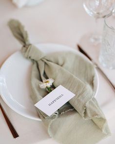 a white plate topped with a green napkin