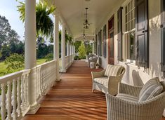 the porch is lined with wicker furniture