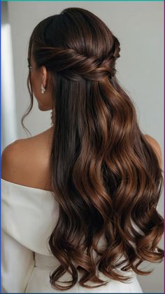 a woman with long brown hair wearing a half updo