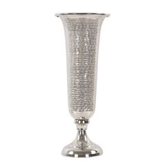 a silver vase sitting on top of a table