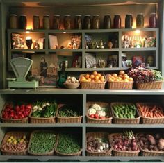 an assortment of fruits and vegetables on shelves