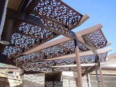 an outdoor area with a pergolated roof