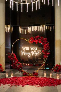 the entrance to a building decorated with roses and candles for valentine's day celebrations