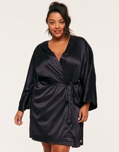 This black kimono robe is made from recycled polyester and has a soft satin fabrication. It comes with a self-tie closure and has a relaxed fit. It's perfect for a cozy night. (Available in plus-sizes 1X-4X.) Satin Wrap Kimono For Loungewear, Satin Open Front Loungewear Robe, Open Front Satin Robe For Loungewear, Black Satin Sleepwear For Loungewear, Black Satin Sleepwear For Lounging, Black Satin Long Sleeve Sleepwear, Black Open Front Robe For Loungewear, Black Satin Sleepwear, Black Long Sleeve Sleep Robe