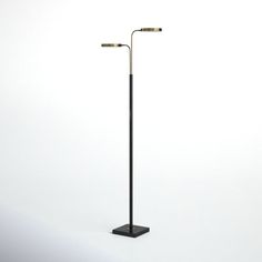 a tall black pole with two lights on each end and one light on the other side