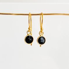 Add some subtle but noticeable color to your everyday look with these exquisite Bezel Gemstone Drop Earrings! Featuring petite faceted gemstones bezel-set and suspended from gold-filled ear wires, you can find the perfect birthstone for you or someone special in the twelve birthstones of the year. An ideal personalized gift for any occasion! -- bezel charm: 6mm French hook ear wires 14k gold filled Dainty Faceted Everyday Earrings, Emerald Drop Earrings, Emerald Earrings Drop, Gemstone Drop Earrings, Unboxing Experience, Black Spinel, Zipped Bag, Gold Drop Earrings, Faceted Gemstones