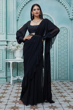 Buy Ariyana Couture Black Draped Ruffle Saree And Puff Sleeve Blouse Set Online | Aza Fashions Black Saree Designs, Long Sleeve Saree Blouse, Black Saree Blouse, Full Sleeves Blouse Designs, Black Blouse Designs, Saree Jacket Designs, Embroidered Cuffs, Saree With Belt, Saree Wearing Styles