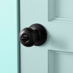 a black door handle on a blue door