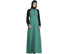 TAFIDA LIGHT GREEN KASHIBO & BLACK JERSEY SLEEVES SPORTS ABAYA Item Details: A flattering fit and bold sporty trim are just the statements of this abaya. -Stand collar. -Front zip opening. -Straight jersey sleeves & contrast cuffs with gathers. -Utility pockets on both sides. -A-line Abaya. -Matching Square Hijab (100*100 cm) and Band Included. Specifications: Colour: Light Green & Black Fabric: Light Green Kashibo (100% polyester) & Black Jersey (100% viscose) Care: Machine and Hand Wash with l Green Fitted Long Sleeve Abaya, Fitted Long Sleeve Green Abaya, Eid Green Maxi-length Abaya, Green Maxi Length Abaya For Eid, Green Maxi-length Abaya For Eid, Fitted Black Thobe For Eid, Green Niqab For Eid, Green Long Sleeve Niqab For Eid, Sports Abaya