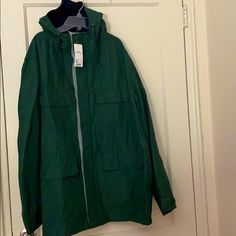 Nwt Uniqlo Green Hooded Jacket Size: 3xl Good Condition Never Worn Tags Attached Oversized Weatherproof Casual Outerwear, Casual Oversized Weatherproof Outerwear, Casual Green Raincoat With Pockets, Uniqlo Winter Outerwear With Pockets, Casual Green Weatherproof Parka, Green Casual Windbreaker For Cold Weather, Casual Green Windbreaker For Cold Weather, Casual Uniqlo Outerwear With Pockets, Brown Joggers