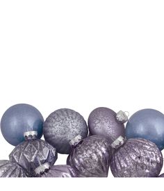 purple and silver christmas ornaments against a white background