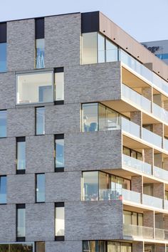 an apartment building with balconies and windows