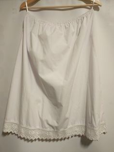 50% cotton , 50 % polyester With beautiful heart lace Chic White Skirt With Lace Patchwork, Summer Cotton Dresses With Delicate Lace, Elegant Summer Skirt With Lace Patchwork, Elegant Cotton Skirt, Lace Skirt With Lace Work, Elegant Mini Skirt With Lace Trim, Delicate Lace Skirt For Spring, Non-stretch Cotton Chic Skirt, Chic Non-stretch Cotton Skirt