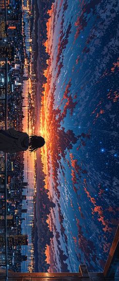 a man standing on top of a tall building next to the ocean at night with city lights in the background