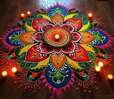 a colorfully decorated rangdi with candles on the floor