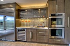 a kitchen with stainless steel appliances and cabinets