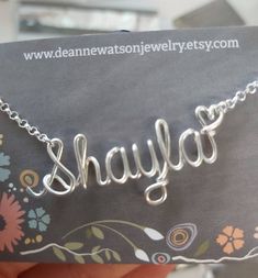 Handcrafted Personalized Jewelry Gifts --- Free Shipping on All Items!This custom name necklace makes a wonderful personalized thank you gift for your bridesmaids, maid of honor or flower girls.Choose any word or name you like up to 10 letters to personalize this necklace. The pendant will be made with the little heart after the name. If you prefer I can leave the heart off - just let me know.Metals available (See drop down menu) :14K Gold Filled Sterling Silver Silver Plated Rose Filled GoldCop Handmade Name Necklace For Personalized Gift, Handmade Silver Name Necklace For Personalized Gift, Silver Name Necklaces For Bridesmaid Gift, Handmade Rose Gold Name Necklace As Personalized Gift, Wire Name Necklace, Customized Bridesmaid Gifts, Junior Bridesmaid, Custom Name Necklace, Bridesmaids Personalized