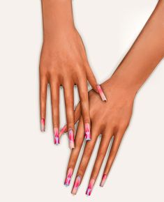 two hands holding each other with pink and white nail designs on them, one hand is touching the other