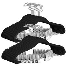 three rows of clothes hangers in black and white