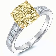 a fancy yellow and white diamond engagement ring