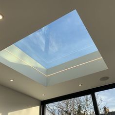 an open room with a skylight in the ceiling