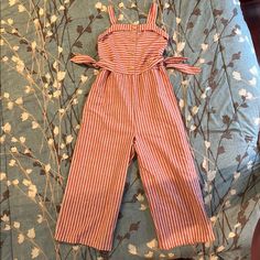 Girls Jumpsuits Red And White Stripe. Elastic Waist In Back And Waist Can Adjusted With Side Tie. So Cute For Fourth Of July Or Memorial Day. Very Comfortable Light Weight Material Can Dress Up Or Down. *Never Worn Perfect Condition. Cute Red Cotton Jumpsuit/romper, Cute Red Cotton Jumpsuit And Rompers, Red Cotton Beach Jumpsuits And Rompers, Red Cotton Jumpsuit For The Beach, Red Cotton Jumpsuits And Rompers For Beach, Sparkly Jumpsuit, Girls Jumpsuit, Flower Romper, Khaki Tops