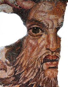 a close up of a mosaic with a man's face