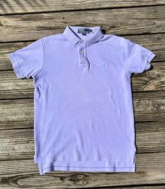 You know the original owner of this shirt was THE BOMB. Vintage pastel purple Ralph Lauren Polo shirt. Size medium but runs a little big so it's more like a large. Slight discoloration under buttons but it's very light. Freshly dry cleaned. Violet Pastel, Pastel Vintage, The Bomb, Ralph Lauren Polo Shirts, Vintage Polo Ralph Lauren, Pastel Purple, Womens Clothing Tops, Polo Ralph, Vintage Ladies