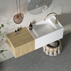 a white sink sitting next to a wooden counter