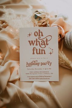 a holiday party flyer sitting on top of a bed