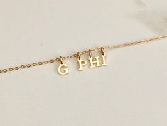 "Show off your sorority pride in style with our Gamma Phi Beta charm necklace. Our exclusive design can be worn alone or layered with your other jewelry. This gorgeous necklace is the perfect gift for initiation, bid day, big little reveal, alumni, etc! Your new necklace will consist of petite gold plated letters (approximately 5mm x 7mm) spelling out G PHI hung on a delicate 18\" gold filled cable chain. Your new necklace will come thoughtfully packaged ready to gift. Please check out my other Personalized Sorority Jewelry Gift, Sorority Jewelry, Gamma Phi Beta, Big Little Reveal, Gamma Phi, Big Little, Gorgeous Necklaces, Cable Chain, Name Necklace