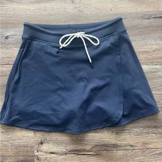 In Great Condition Never Worn New With Tags Size - Small Built In Shorts Navy Casual Skort For Summer, Casual Swim Skirt With Pockets For The Beach, Casual Beach Swim Skirt With Pockets, Casual Navy Skort With Pockets, Navy Casual Skort Short Length, Casual Navy Skort, Navy Casual Short Length Skort, Blue Casual Short Swim Skirt, Casual Blue Short Swim Skirt