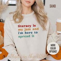 Literacy Is My Jam And I'm Here To Spread It Sweatshirt, English Teacher Sweatshirt, English Coach, Literacy Teacher Sweatshirt 💫Ideal for any situation, a unisex heavy blend crewneck sweatshirt is pure comfort.  💫 Made with a medium-heavy fabric blend of 50% cotton and 50% polyester, this sweatshirt feels cozy and is the perfect choice for those colder months. 💫 Made using 100% ethically grown US cotton. Gildan is also a proud member of the US Cotton Trust Protocol ensuring ethical and sustainable means of production. The blank tee's dyes are OEKO-TEX-certified dyes with low environmental impact. 💫 Fabric blends: Heather Sport colors - 60% polyester, 40% cotton 📢 **Contact us if you need more information 👉🏿Designed specifically for individuals, companies, groups, families, or any c Autoimmune Disease Awareness, Night Worker, Iron Lady, Bff Shirts, Neonatal Intensive Care Unit, And Justice For All, Nurse Sweatshirt, Club Sweatshirts, Nurse Appreciation