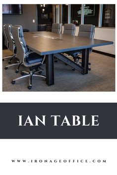 an empty conference table with chairs around it and the words i am table above it