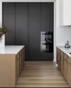 a kitchen with wooden cabinets and white counter tops