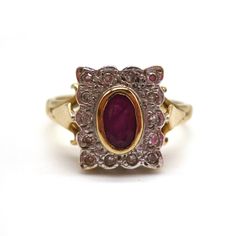 Vintage gold ring in an Art Deco style, with white gold rectangular tablet face, set with a central yellow gold bezel set ruby within a border of tiny diamonds. The face of the ring measures approx. 11mm top to bottom. The ruby measures approx. 5mm top to bottom. The diamonds are each approx. 1mm. UK Size L/M- US Size 6 In very good condition with light surface wear. Hallmarked for 9k gold. Weighs approx. 3 grams. Your ring will be sent gift wrapped. Any boxes used in photos are for display purp Classic Gold Rectangular Ruby Ring, Classic Rectangular Ruby Ring In Gold, Classic Gold Ruby Ring With Rectangular Shape, Luxury Rectangular Ruby Ring, Hallmarked Rectangular Ruby Ring For Formal Occasions, Vintage Rectangular Ruby Ring For Formal Occasions, Fine Jewelry Ruby Ring, Rectangular For Formal Occasions, Rectangular Red Ruby Ring For Formal Events, Rectangular Ruby Ring In Gold