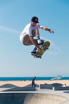 a man flying through the air while riding a skateboard