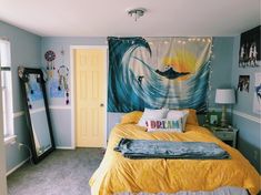 a bed room with a neatly made bed and a large painting on the wall above it