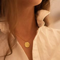 This chunky gold coin layered necklace is perfect for anyone that wants a little sparkle! The necklace is made entirely of solid sterling silver, and then coated in genuine 14k gold plating. Features a small coin circle design with a textured image of a goddess. The pendant is approx. 17mm and the necklace chain comes with an extender chain and measures 44cm in total length. Fast Shipping! It'll be packaged and posted beautifully, perfect for gifting! To keep your Elk & Bloom jewellery looking a Gold Goddess, Gold Medallion Necklace, Gold Disc Necklace, Medium Hoop Earrings, Buy Jewellery Online, Gold Coin Necklace, Gold Link Chain, Coin Pendant Necklace, Gold Medallion