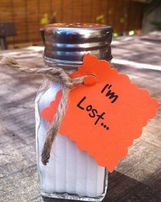 a glass jar with an orange label that says, i'm lost on it