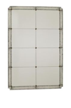 a white wall mounted mirror with metal frame