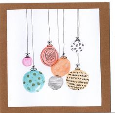 a card with ornaments hanging from strings