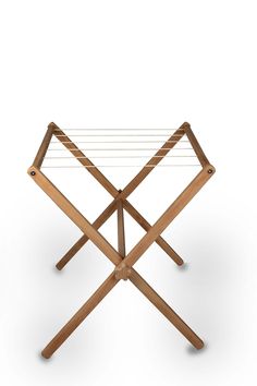 an ironing board with two clothes rails attached to the top and bottom, on a white background