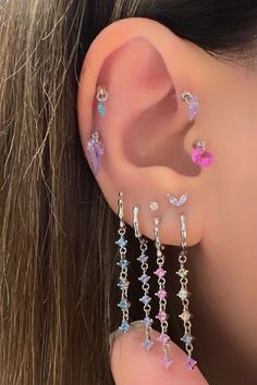 Thank you for taking time to look at my shop . I hope you enjoy my designs as much as I enjoyed creating them for you ! Pastel Multicolor CZ Huggie Hoops,Dangling Colorful Charm Hoops,Vermeil,925 Silver,Five Solitaire Dangle Bone Hoop Earring,Pink,Lilac Colors -Can covered by 14 kt. rose gold, 14 kt. yellow gold or rodium. -Material:  925 kt. Silver -Diameter of hoops:10 mm you can shown the details 360 degree videos.  This piece is a product that you can combine with many products. Attention for the price .this price for the one piece . If you want to buy pair , you can add 2 pieces. and also attention for zirconia color don't miss the select.  You can buy this product, which will add glamorous beauty with its shine, as a single or a pair, without you knowing it. This product is 925 kt. s Trendy Pink Sterling Silver Earrings, Cute Purple Dangle Jewelry, Dainty Pink Hypoallergenic Hoop Earrings, Pink Sterling Silver Huggie Jewelry, Pink Sterling Silver Hoop Earrings For Pierced Ears, Pink Huggie Pierced Jewelry, Iridescent Dangle Crystal Earrings For Pierced Ears, Pink Nickel-free Dainty Hoop Earrings, Pink Sterling Silver Hoop Earrings