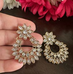 Adorable, effortless minimal and unique! A complete guide to cute outfits and style lover aesthetics❤️ This one is made for a charmer like you with all the love from Noorzaracollection! These beautiful small chandbali earrings in crystal stones m are ready to ship. Color : crystal, champagne Hand crafted and gold plated kundan indian/pakistani jewelry Material:brass,stone,gemstone,pearl We bring you casual as well as party wear jewelry which comes with an attractive design and style. It goes wel Traditional Crystal Earrings For Festive Occasions, Bridal Earrings For Diwali, Bollywood Bridal Chandbali Earrings, Chandbali Earrings With Stone Work, Elegant Jhumkas With Mirror Work, White Chandbali Bridal Earrings, Wedding Chandbali Single Dangler Earring, Diwali Festival Chandbalis Drop Earrings, Traditional Crystal Party Earrings