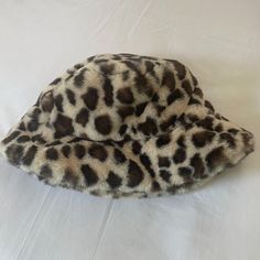 A Faux Fur Leopard Print Bucket Hat. New, Never Worn. Adjustable Brown Hats With Faux Fur Lining, Brown Bucket Hat For Winter, One Size, Brown Winter Bucket Hat, One Size, Brown Winter Bucket Hat One Size, Brown Winter Bucket Hat In One Size, Winter Brown Bucket Hat One Size, Trendy Brown Bucket Hat For Fall, Pink Baseball Hat, Corduroy Bucket Hat