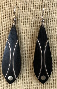 These fabulous earrings are Circa 1950s and are ebony and silver inlay dangling pierced earrings in a wonderful modernist design that reminds me of fish. The earrings are unmarked so I have no idea who made them. I'm also not sure if the silver wire is sterling silver or just silver tone, I'm inclined to think that they might be chrome or stainless steel, to be honest, and the hooks do not look like they're sterling. It would be easy for the buyer of these earrings to swap out the French hooks f Retro Teardrop Earrings, Vintage Black Drop Earrings, Black Retro Earrings, Retro Teardrop Earrings For Pierced Ears, Midcentury Minimalist, Coconut Wood, Fish Earrings, Decatur Ga, Modernist Design